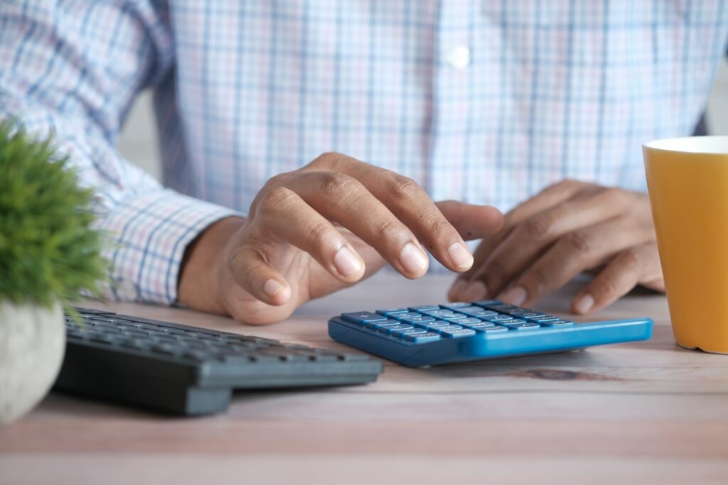 person using blue calculator