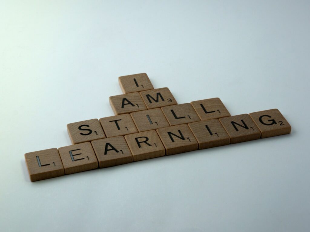 how to become a foster carer UK
scrabble blocks saying ' I am still learning'
